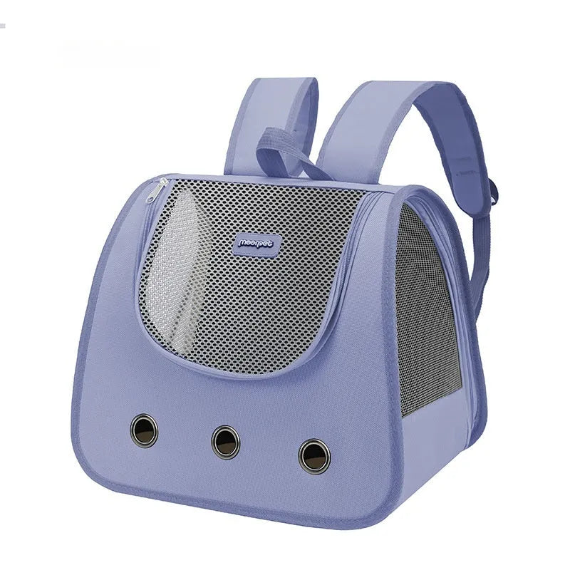 Light blue Oxford fabric cat backpack carrier with mesh panel, shown on a person's back.