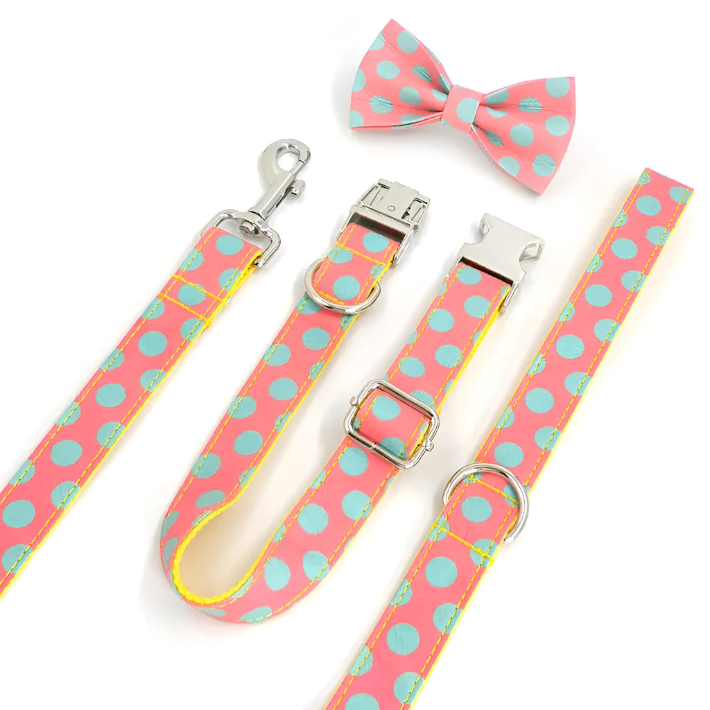 Yellow polka dot dog collar with bow and matching lead rope set on a white background.