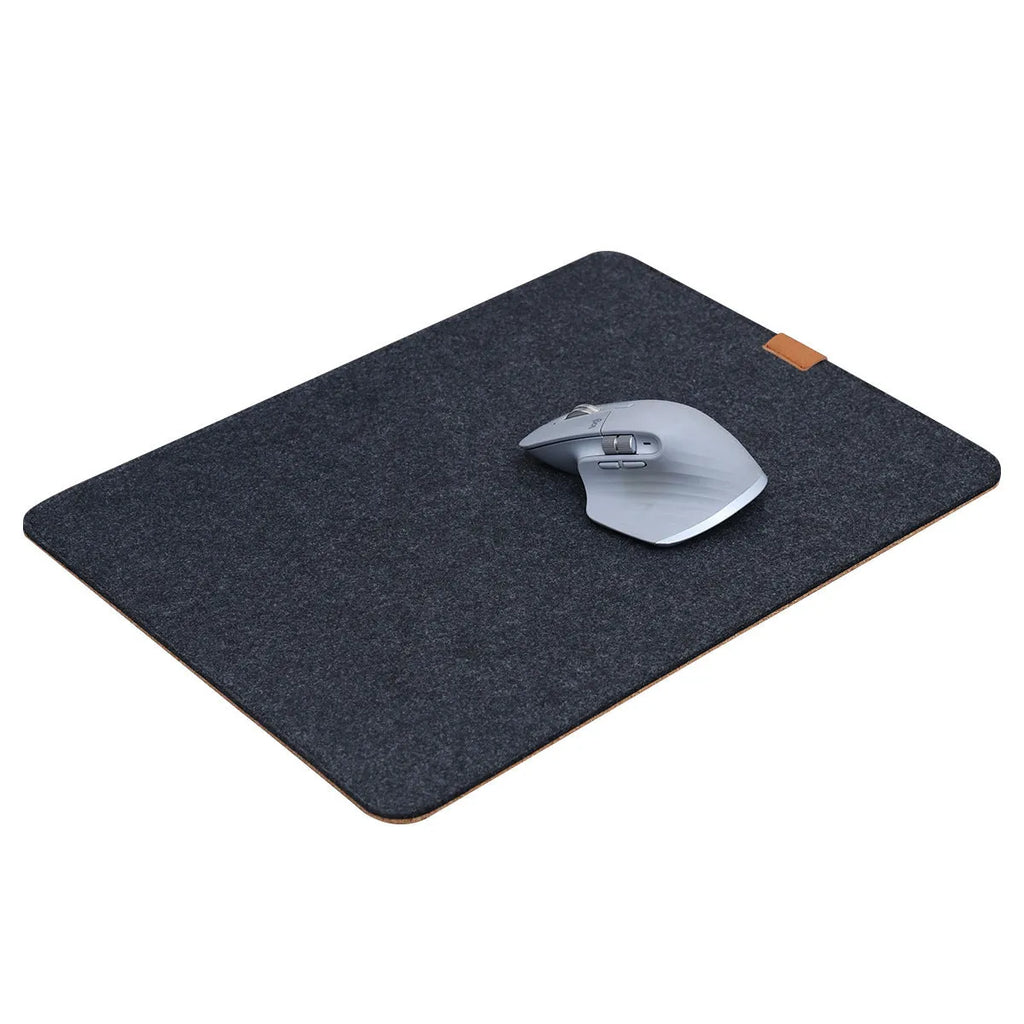 Felt cork desk mat in black gray pattern on a wooden desk with a mouse and keyboard