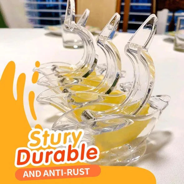 Clear acrylic bird-shaped manual lemon juicer on a kitchen counter