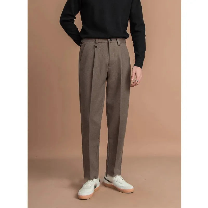 Men's straight-leg casual trousers in draped design, shown in a neutral colour on a hanger.