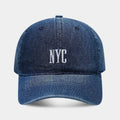 Retro denim peaked cap with embroidered letters on the front, shown in an adjustable size.