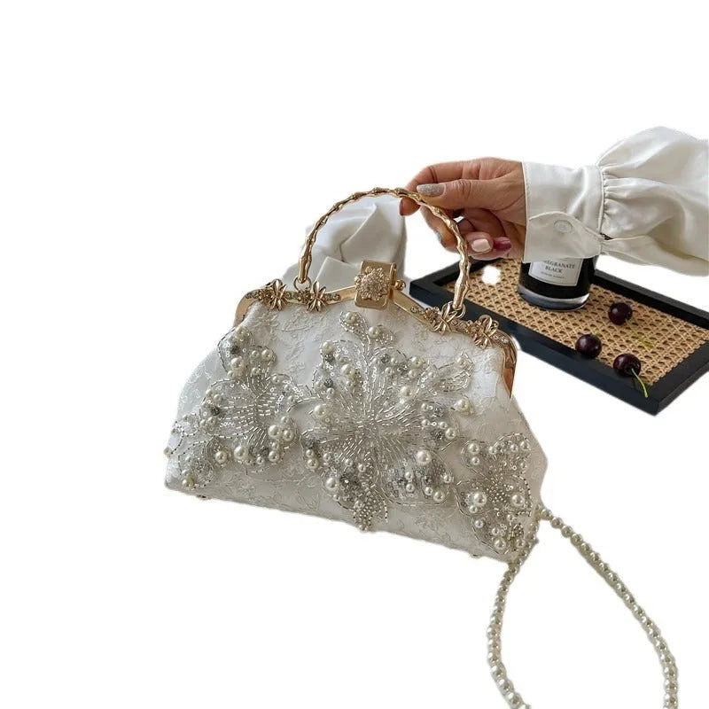 Pearl embroidered soft polyester handbag with double shoulder straps in floating light-white colour