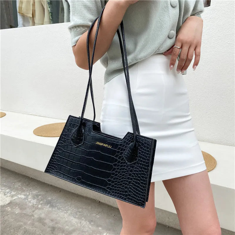 Small square PU handbag with crocodile pattern, sewing line detail, medium hard build, 27x16x7cm, black colour
