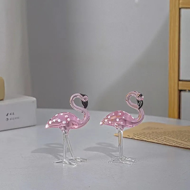 Pink and white crystal flamingo decorative ornament on a table, showing modern simple style.