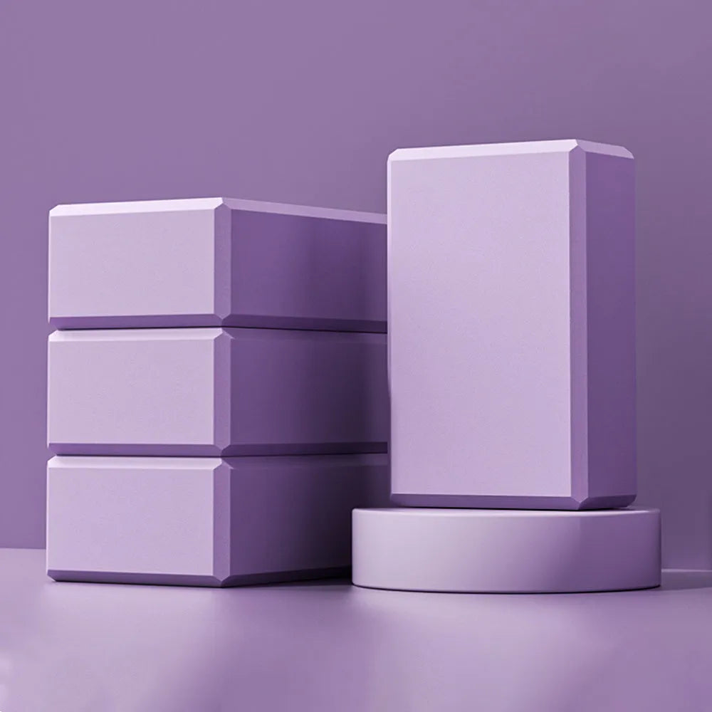 Solid colour EVA foam yoga block with grip ridges measuring 23x15x7.6cm