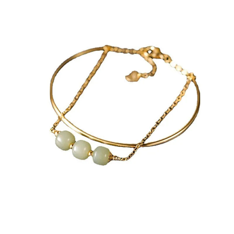 Women's jade lucky beads bracelet with gold inlay treatment in single, double, and three bead styles.