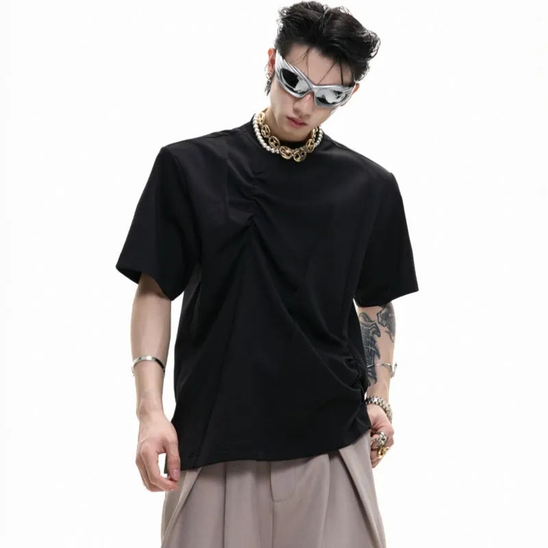 Men's loose grey cotton T-shirt with round neck and asymmetric stitching on the front.