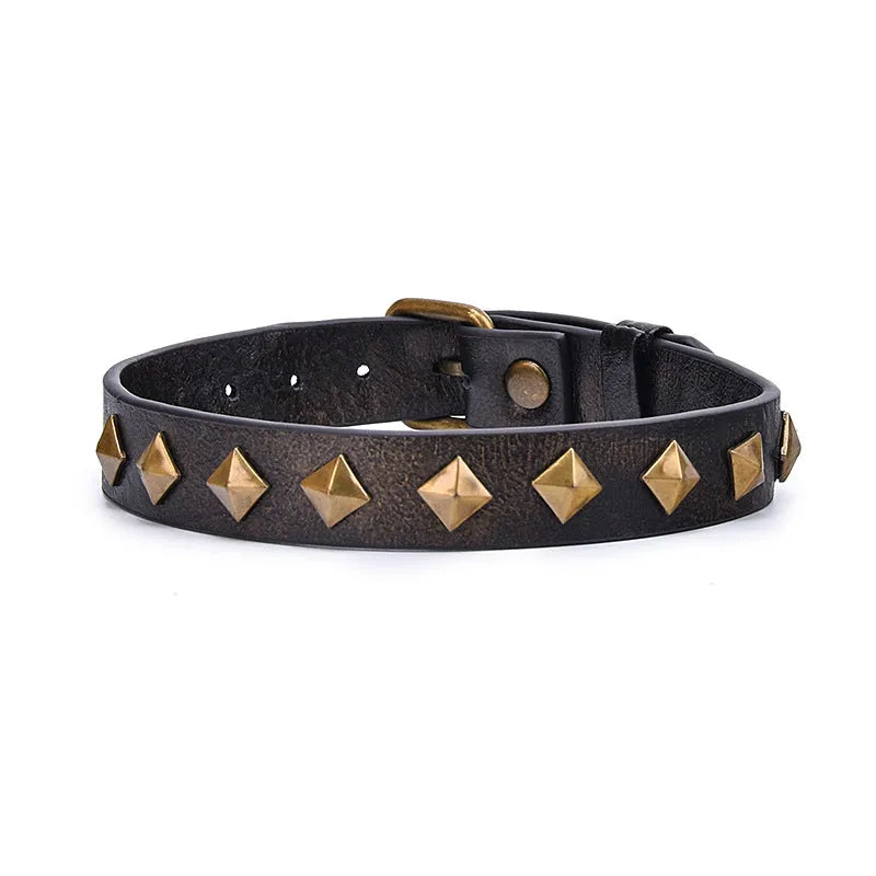 Bronze rivet cowhide leather punk collar with buckle closure on display