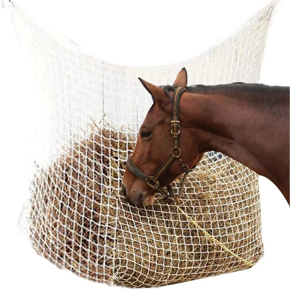 Woven PE rope horse hay feeding bag in black, 120x90cm size, hanging on a fence for livestock feeding