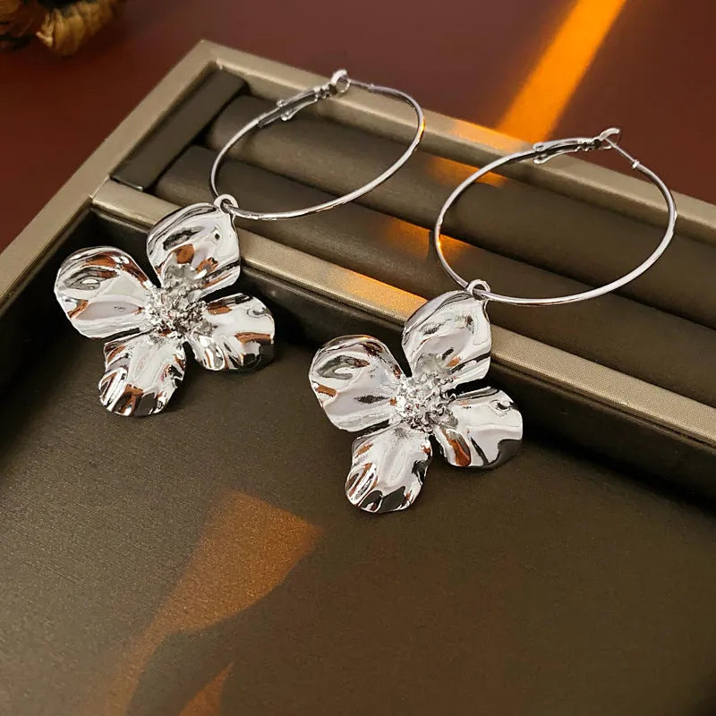 Vintage silver and gold metal flower earrings with geometric shapes and electroplated finish.