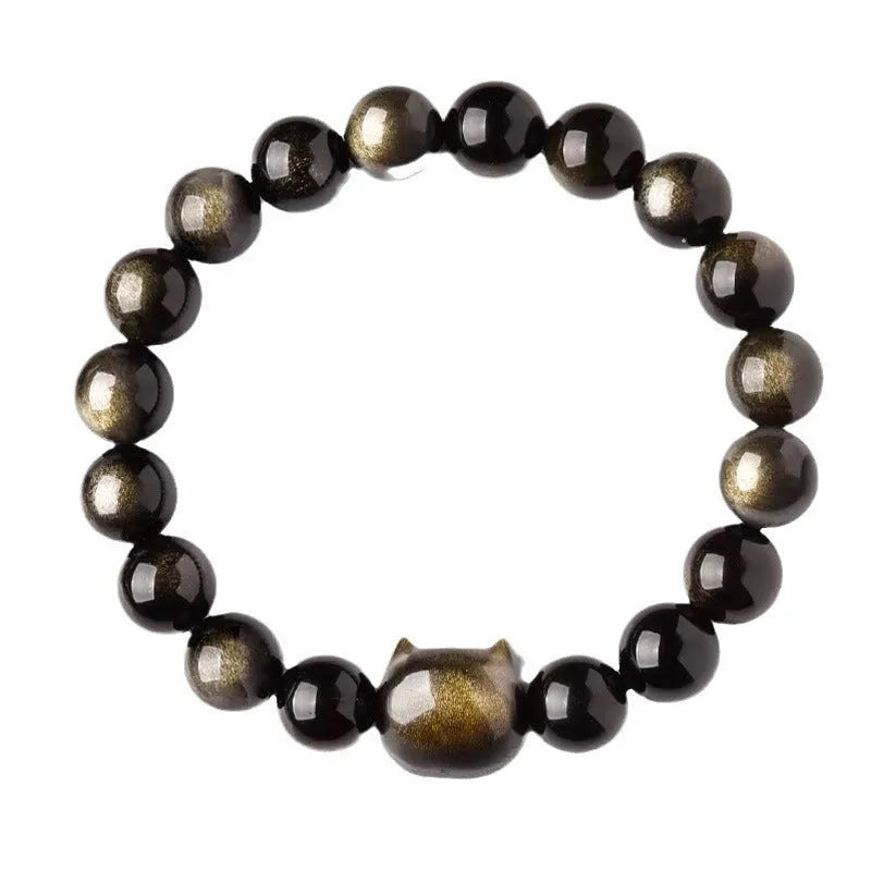 Obsidian cat head bracelet with round beads in gold or silver style, showing cat charm detail.