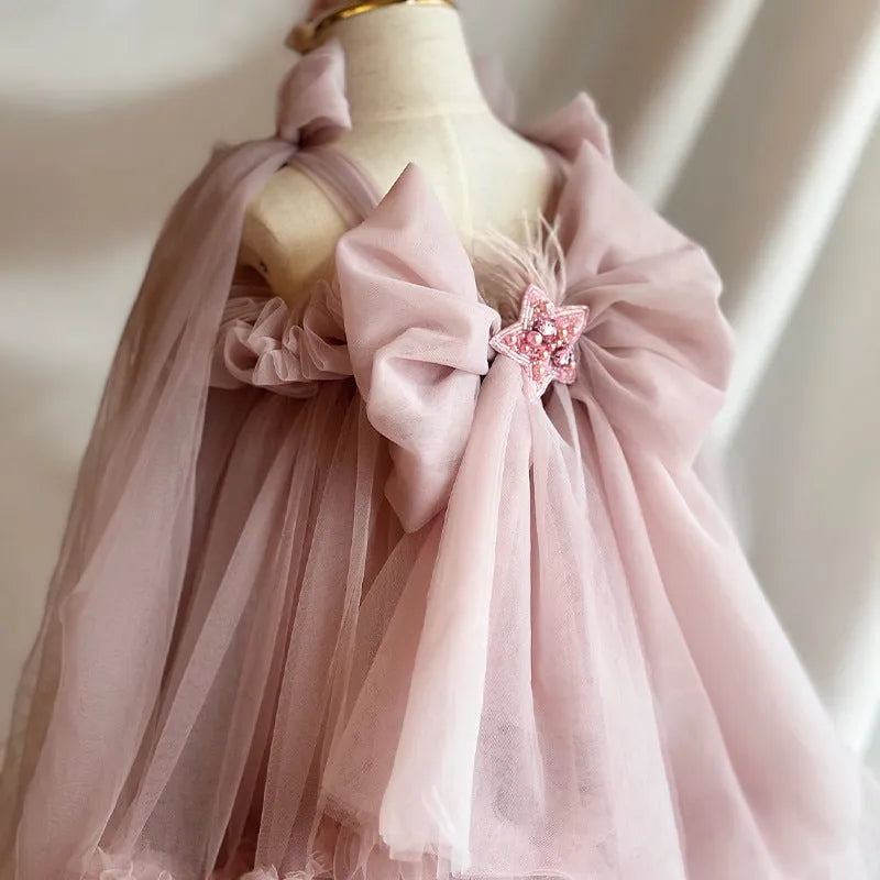 Pink floral children's princess dress with spaghetti straps and bow detail