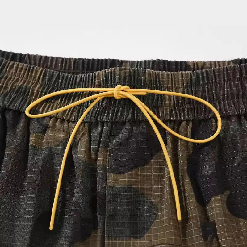 Green H215 washed camouflage cotton work shorts with multiple pockets in mid-waist loose fit