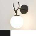 Round glass Nordic wall lamp with golden water pattern finish on a white wall.