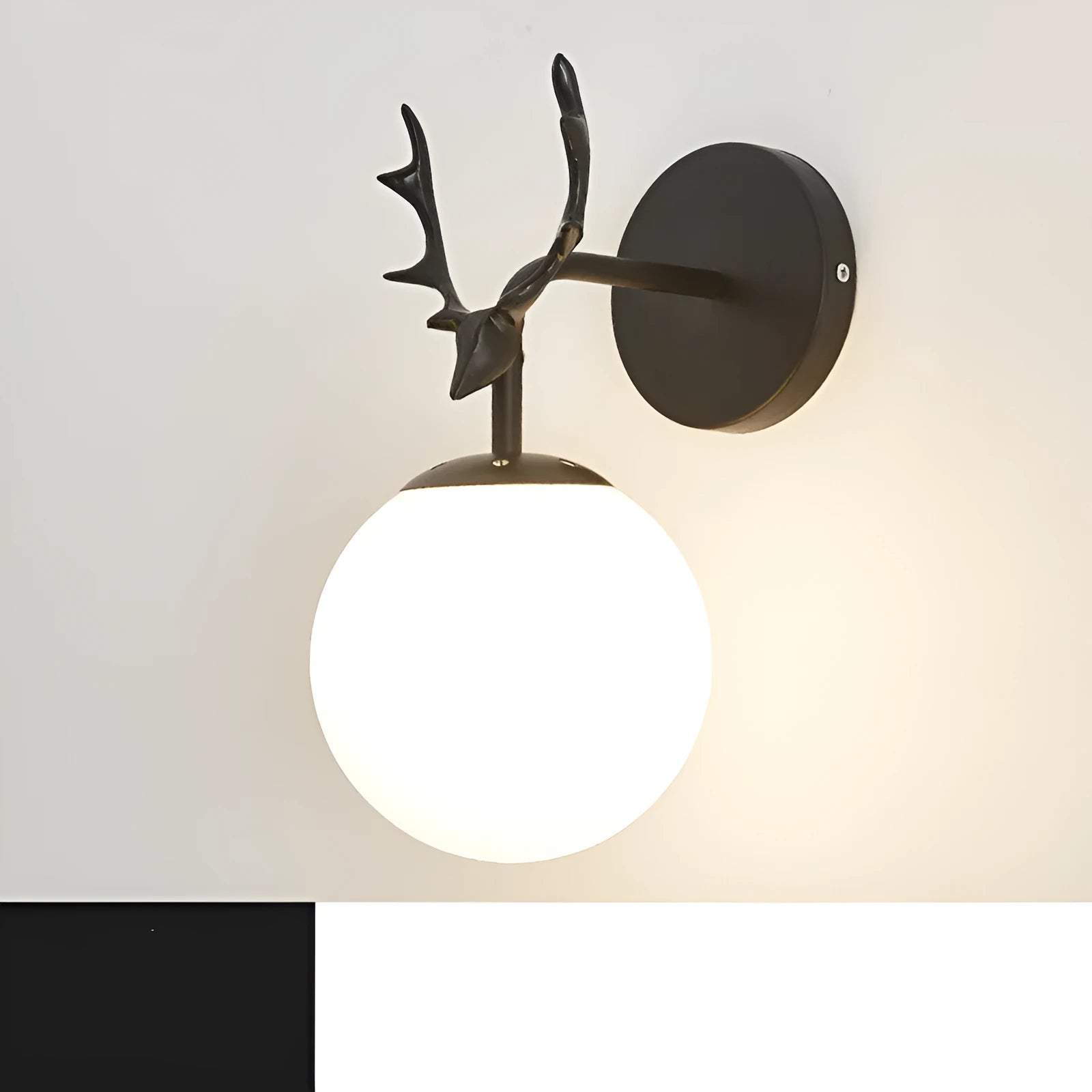 Round glass Nordic wall lamp with golden water pattern finish on a white wall.