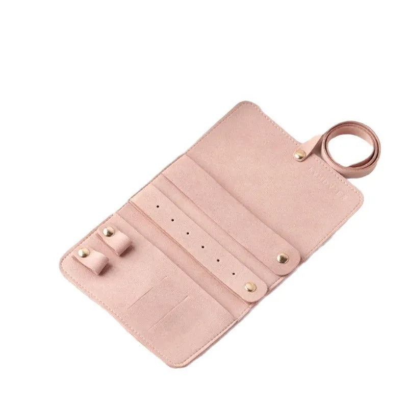 Brown soft leather and microfiber jewellery storage pouch measuring 12 by 12 centimetres.