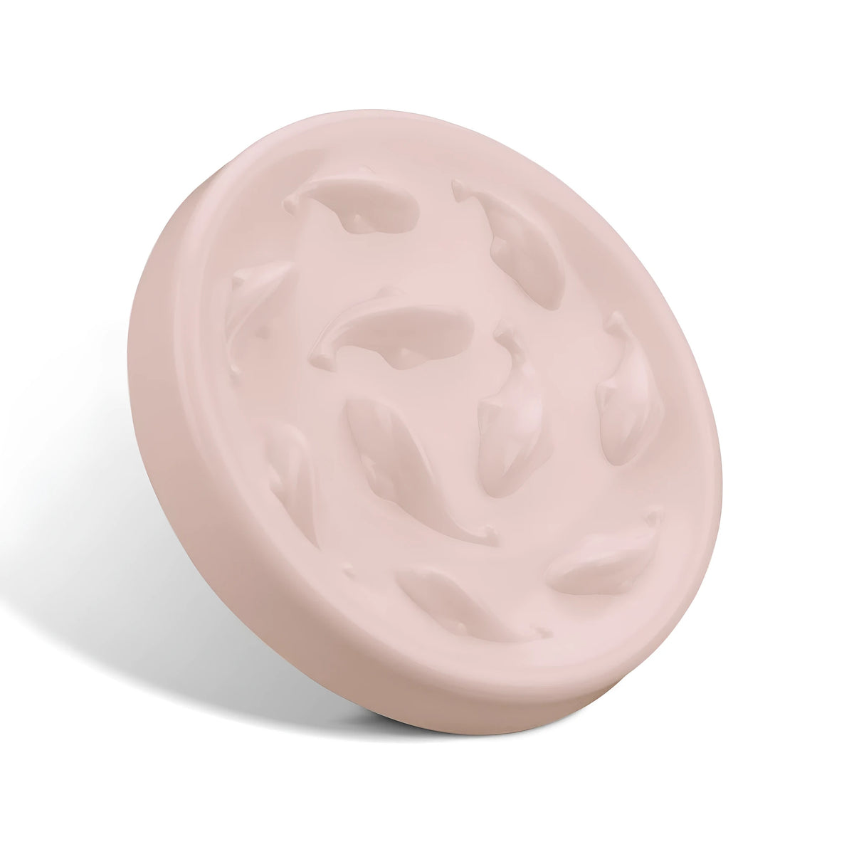 Pink whale-shaped cat slow feeding bowl with raised edge and non-slip base on a floor