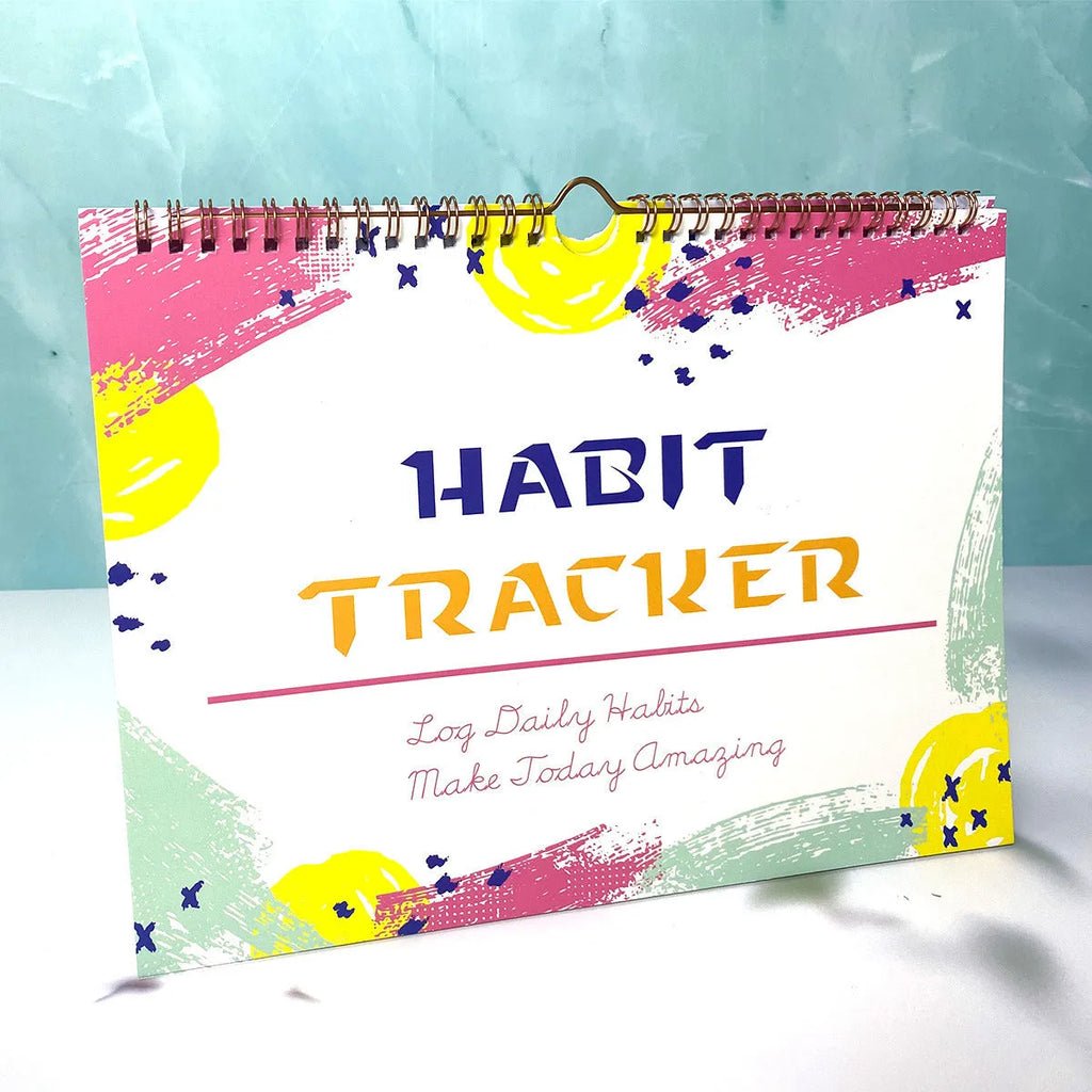 Habit tracking journal in four colour options showing 21cm × 28cm size