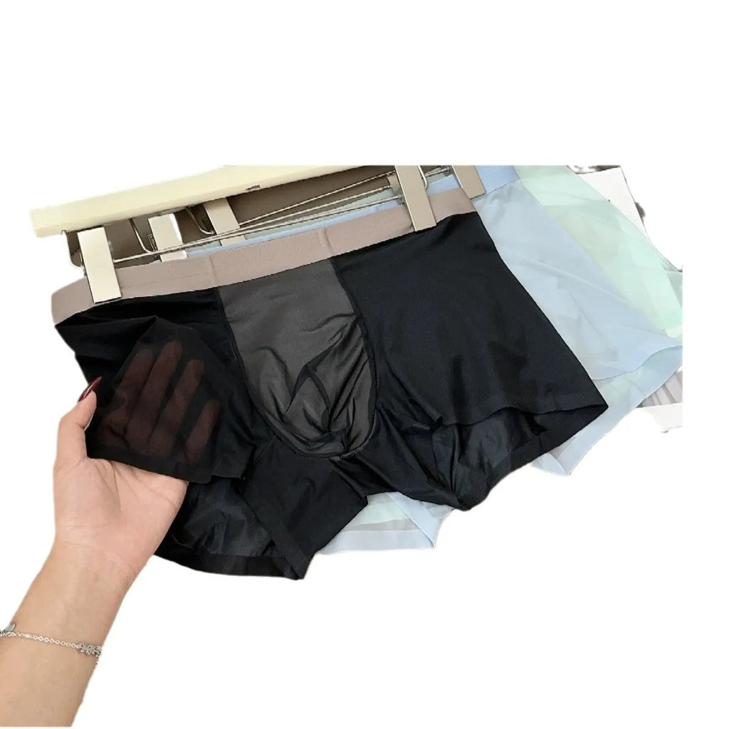 Ultra-thin antibacterial seamless men's boxers in honeycomb fabric on a colour swatch background.