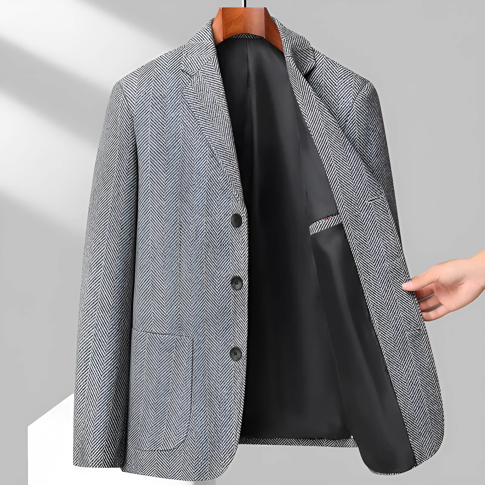 Man wearing a loose-fit solid colour wool-blend coat suitable for spring or autumn casual wear.