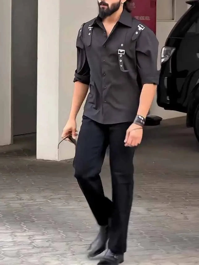 Man wearing a regular fit black polyester button-up utility shirt.