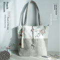 Artistic retro canvas shoulder handbag with hand-painted literary design and copper zipper