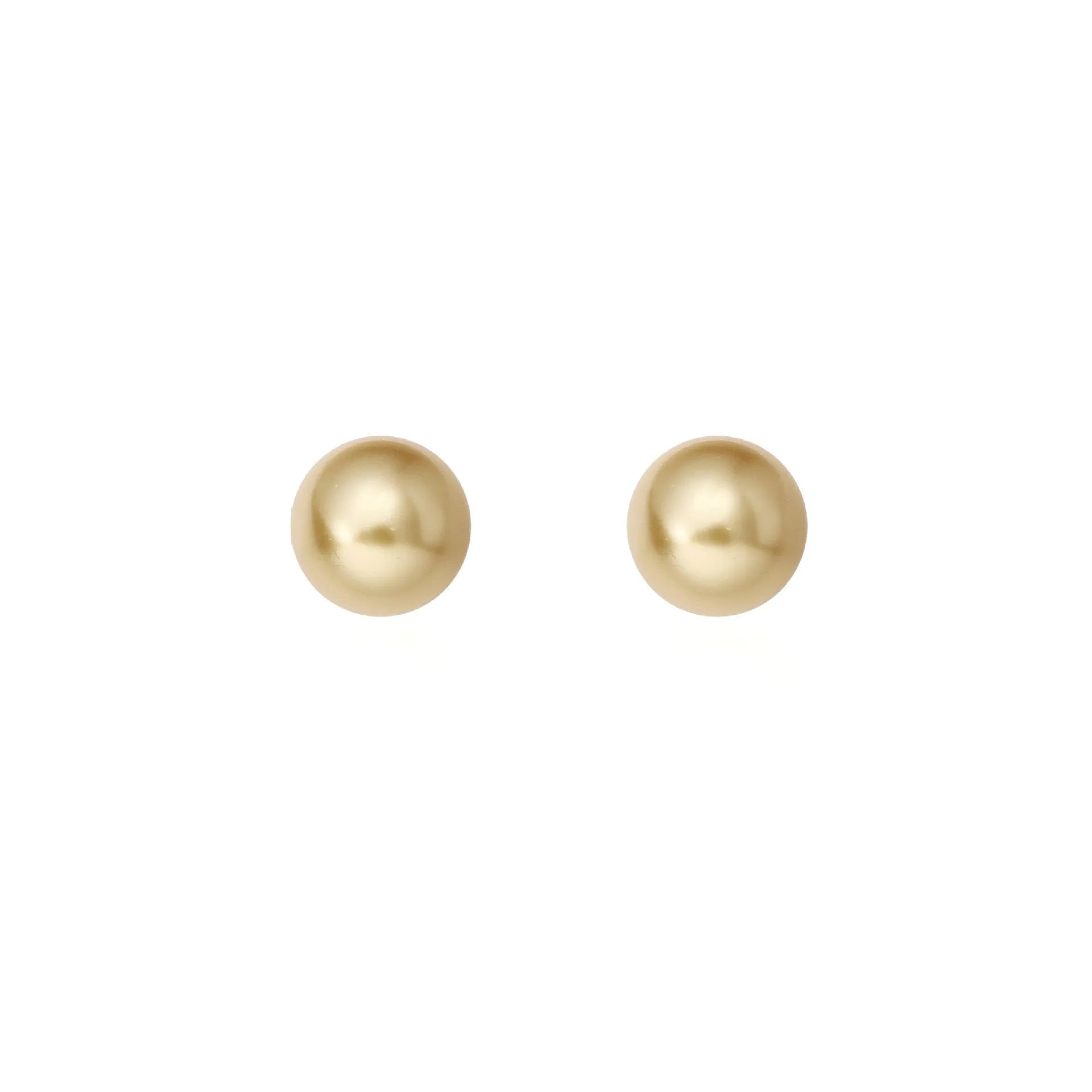 A pair of large pearl stud earrings with a geometric silver setting and an eight-point star detail.