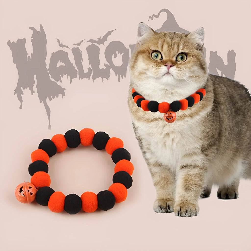 Orange and black Halloween cat collar with pumpkin design and plastic quick-release buckle.