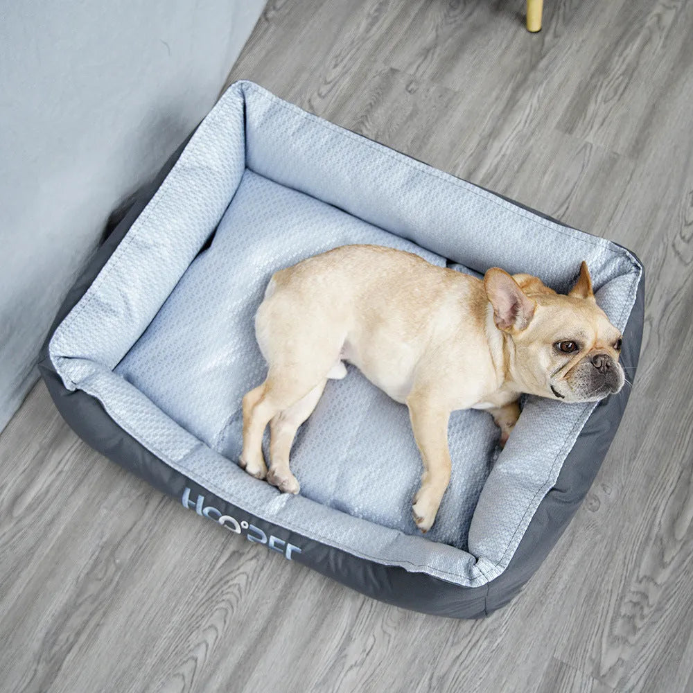Soft grey dog bed with raised sides and a removable cover, shown in medium size.