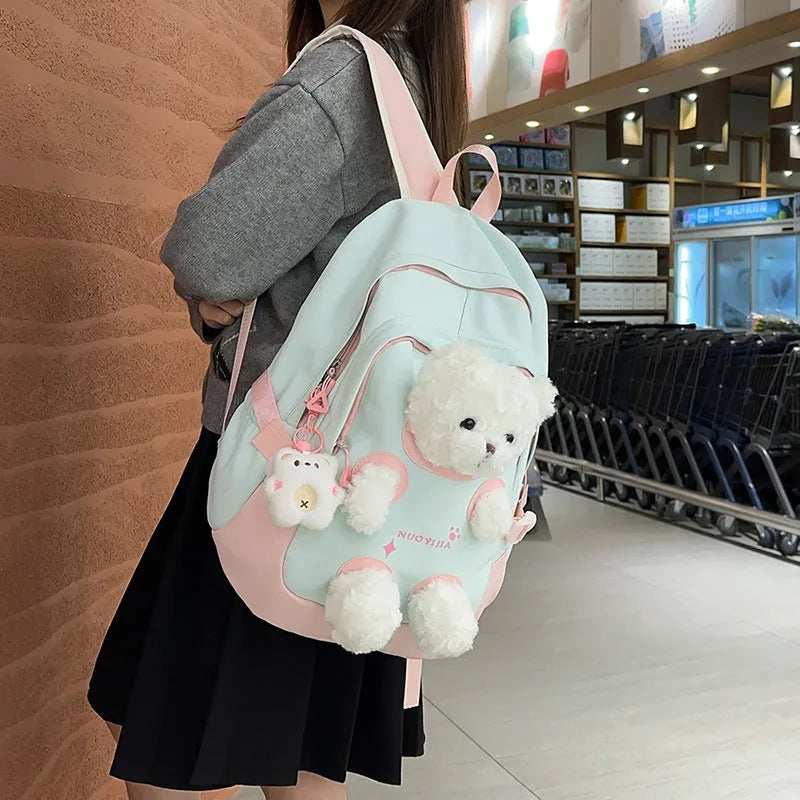 Nylon school backpack in macaron colours with curved shoulder straps and 20-35L capacity