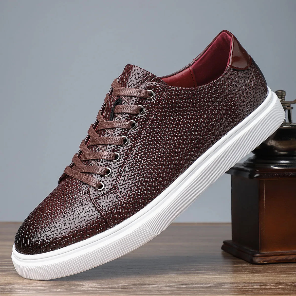Men's black low-top leather business shoes with stitched detailing and a rubber sole.