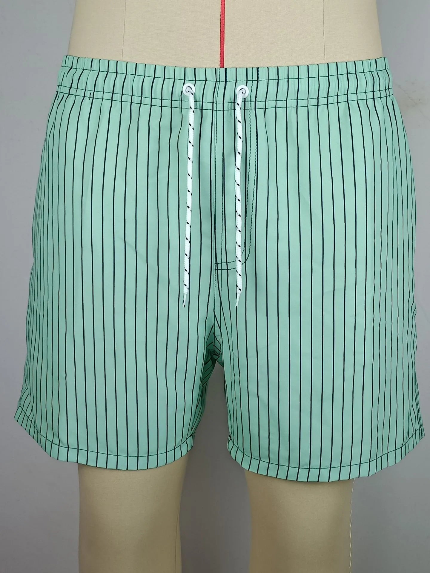 Striped casual shorts in light blue with straight leg opening and triangle lining detail.