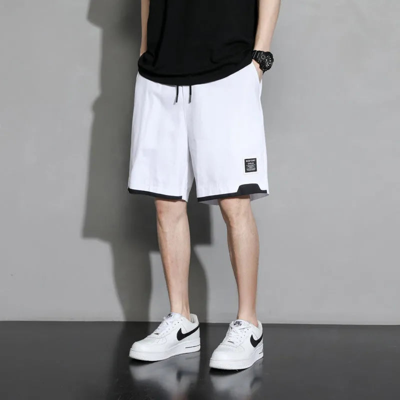 Boy wearing black cotton plus-size shorts with a mid-waist and casual overalls style.
