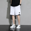 Boy wearing black cotton plus-size shorts with a mid-waist and casual overalls style.