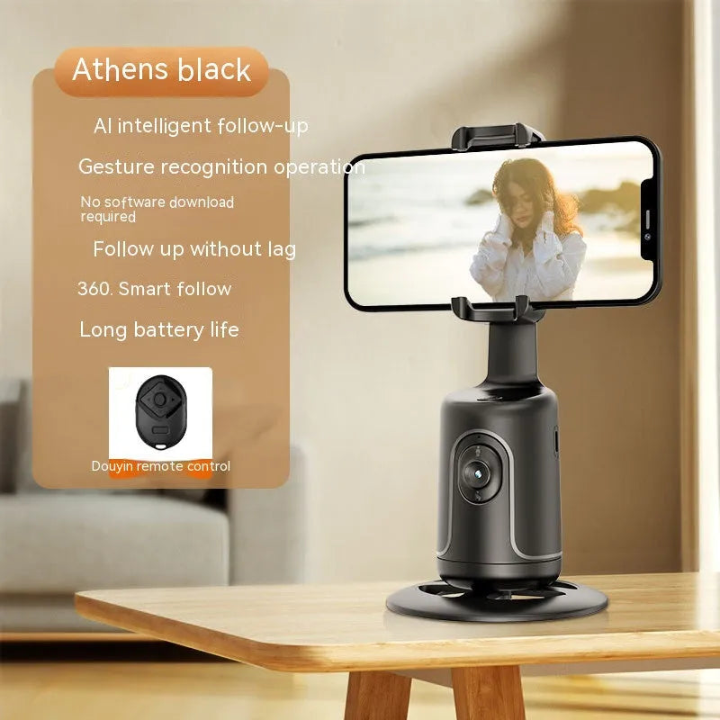 New Automatic Tracking Stabiliser with 360° rotation, ABS body, dark black colour, on a desktop with USB cable
