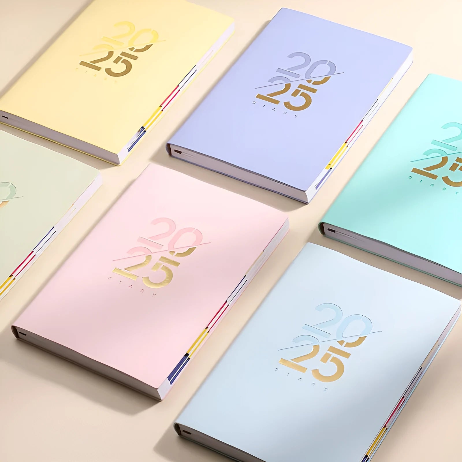 A5 daily planner notebook with soft faux leather cover in blue, lying open on a table.