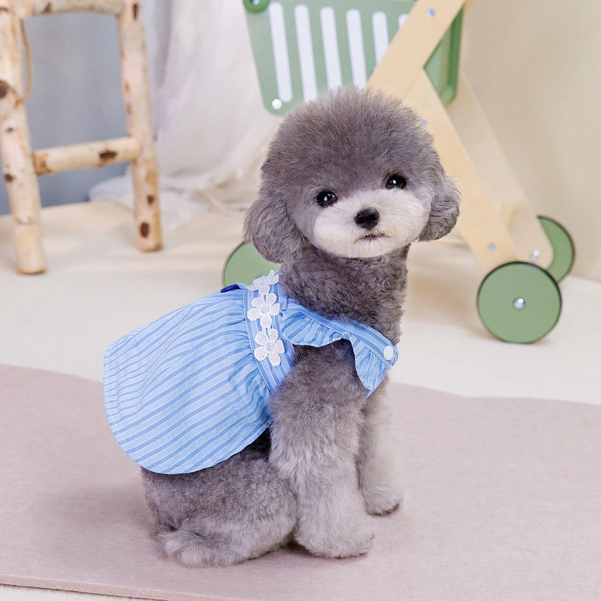Pink and blue stripe vertical stripe princess style dog dress on female dog