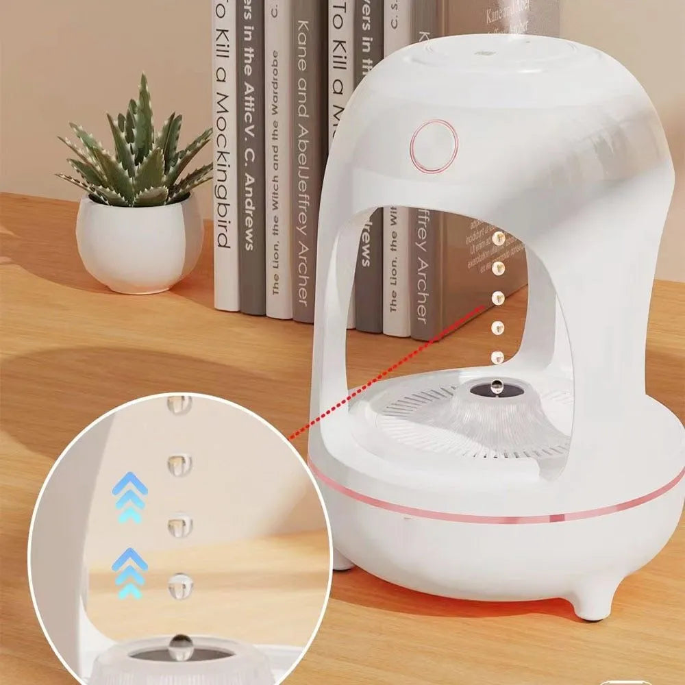 Rose gold and white levitating water drops ultrasonic humidifier and LED night light on a desk