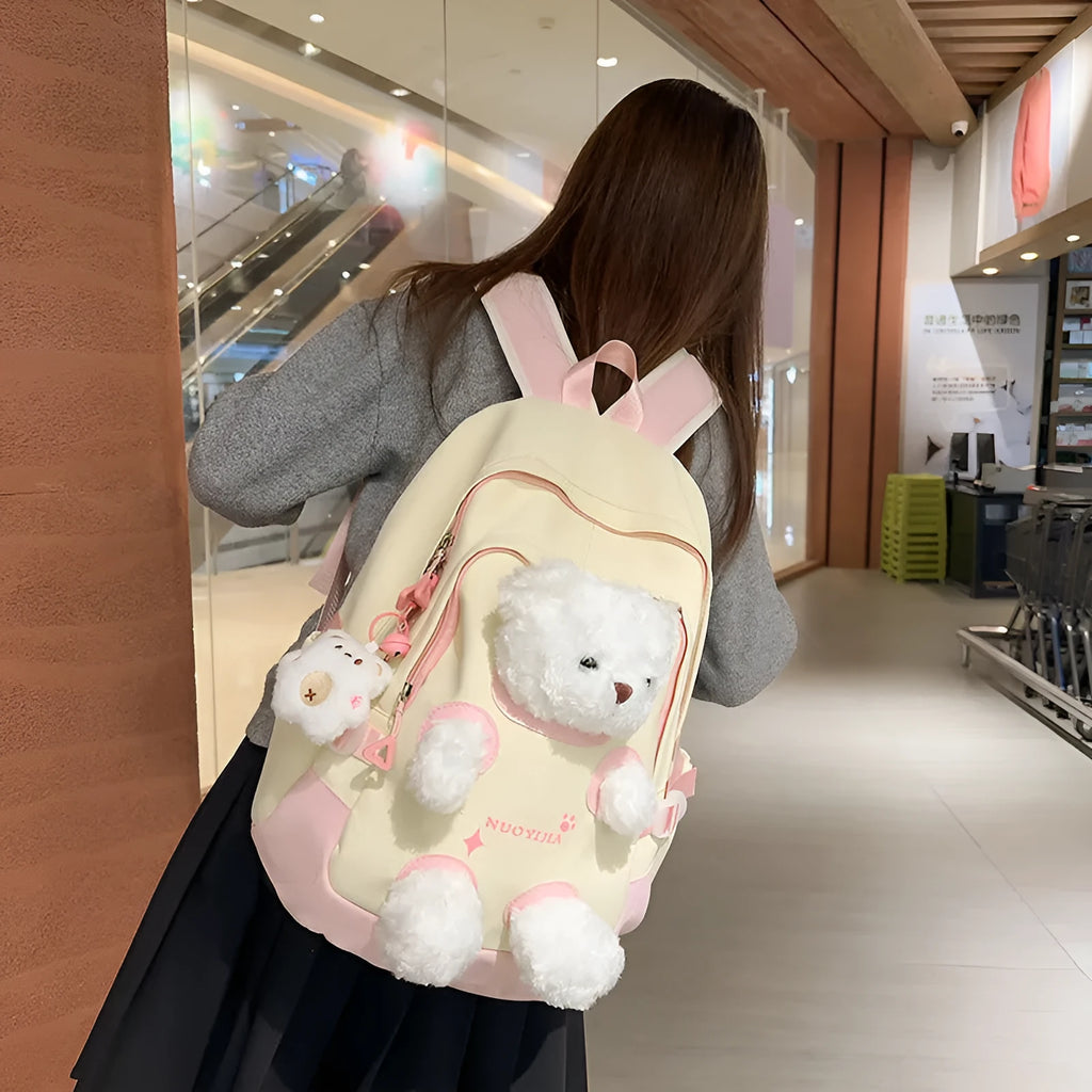 Nylon school backpack in macaron colours with curved shoulder straps and 20-35L capacity