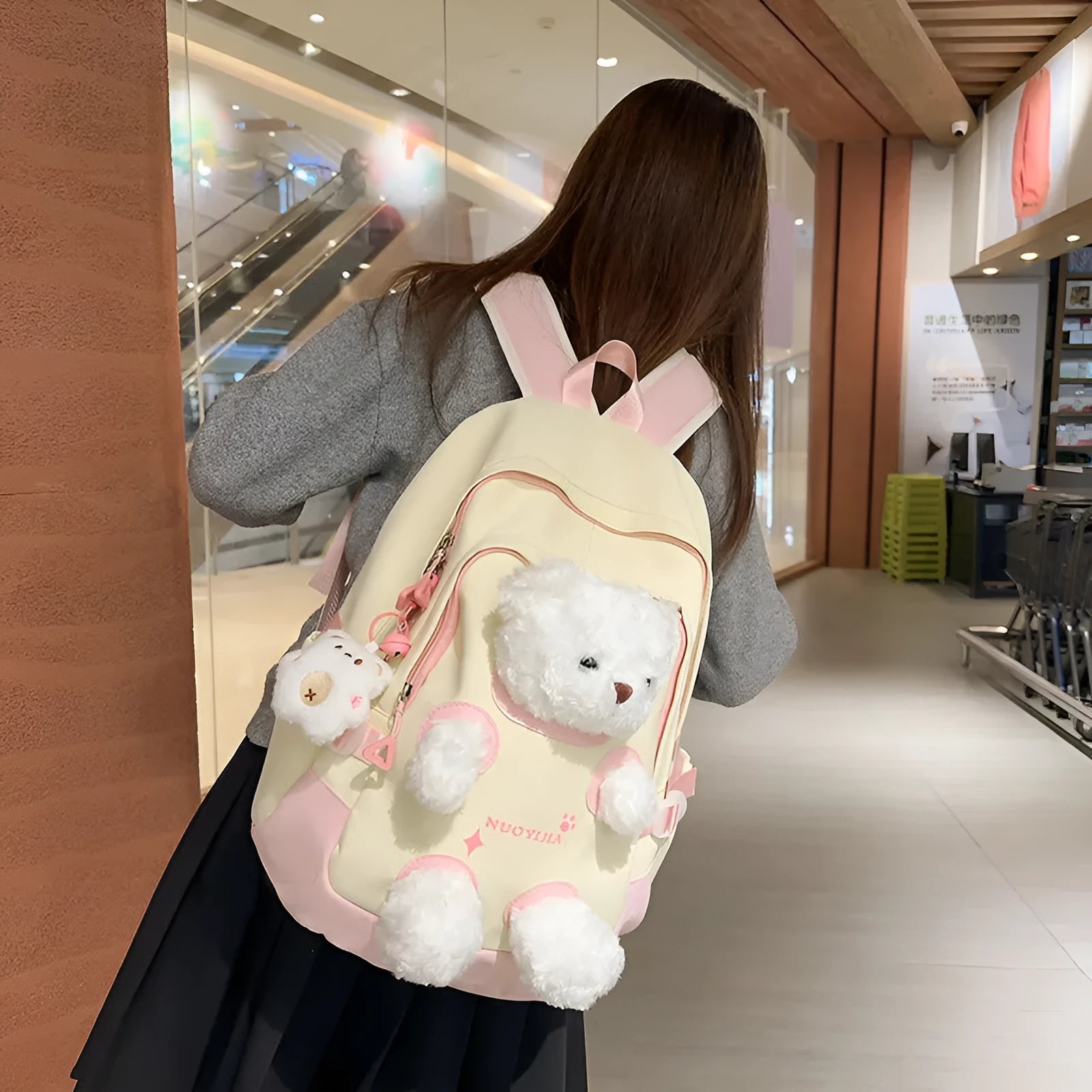Nylon school backpack in macaron colours with curved shoulder straps and 20-35L capacity