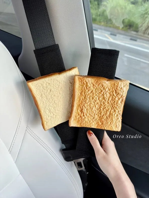 Toast bread safety belt shoulder pad in white toast colour on a car seat belt for driving comfort