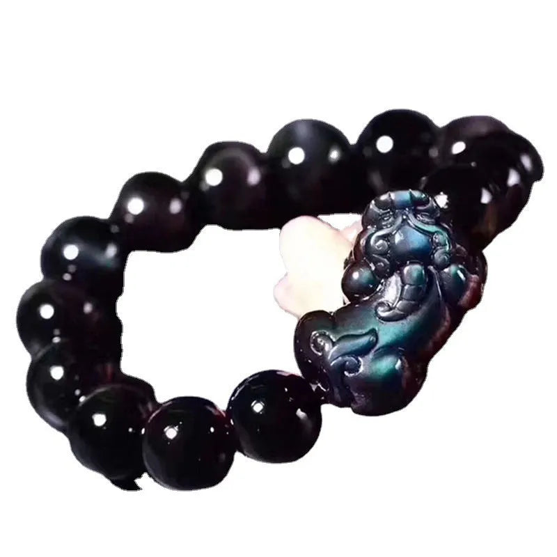 Natural ice colour eye obsidian crystal bracelet with varying bead sizes on wrist