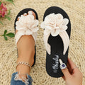 Solid-colour flip-flops with floral design on lightweight EVA sole in beige, red, black, and green options