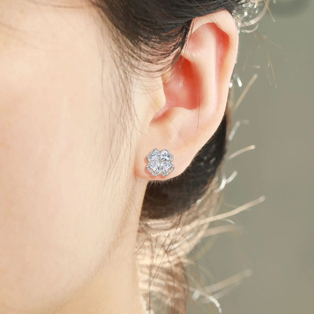 Pair of heart-shaped zircon earrings in 925 silver with a white gold finish.