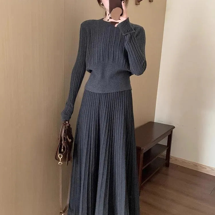 Dark grey knitted two-piece dress suit with 3D pattern, featuring a sweater and skirt in retro ethnic style.
