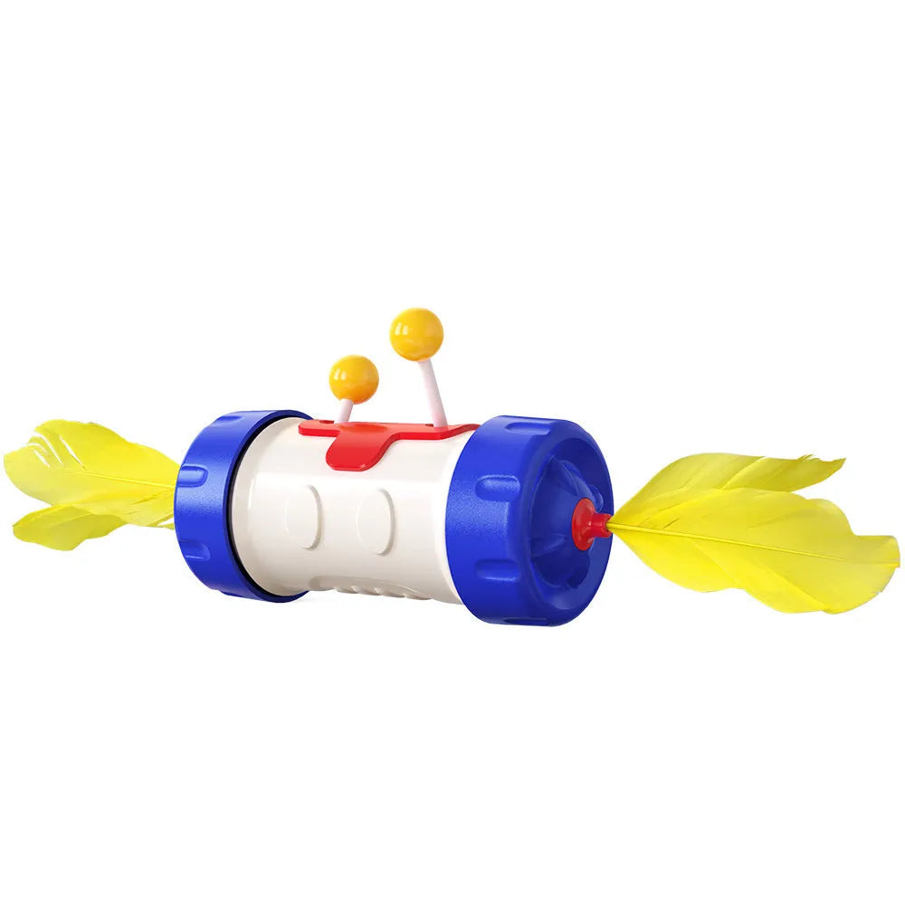Colourful interactive cat toy with feather ball, stick pole, and tumbler on a flat surface.