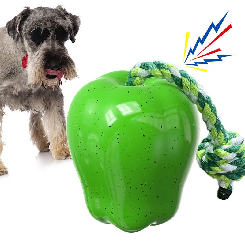 Green and red plastic dog toy shaped like a molar with a hollow centre for treat dispensing.