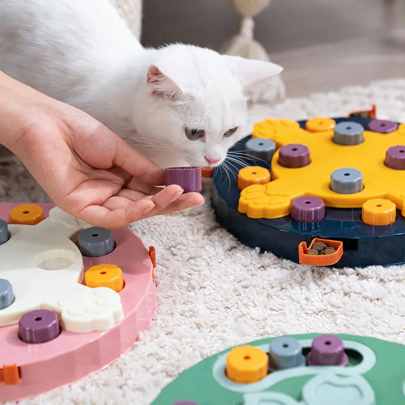 Blue interactive dog slow feeder puzzle toy with multiple food compartments on textured base
