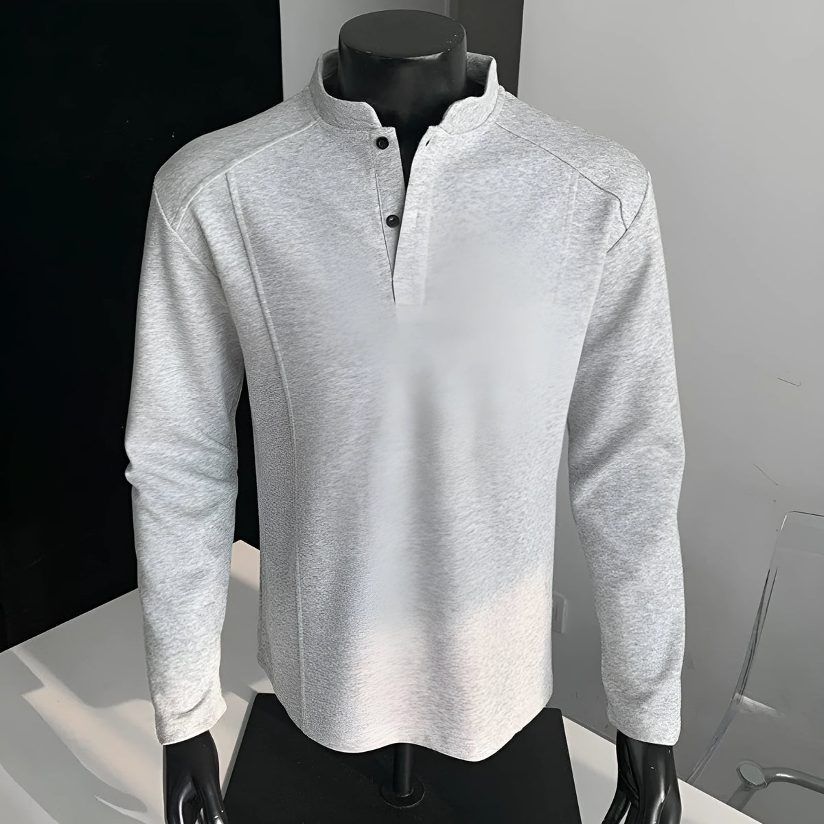 Men's patchwork stand-up collar sweater in black with asymmetric shoulder and long sleeves, loose fit